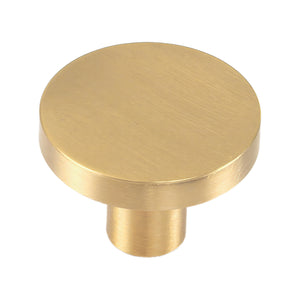 Brushed gold-tone flat disc cabinet knob on a cylindrical stem, option No. 6, 27 mm.