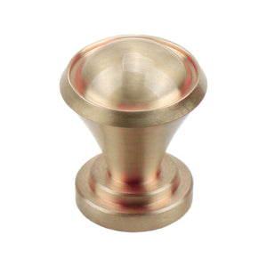 Brushed gold round cabinet knob with a cupped top, option No. 4.