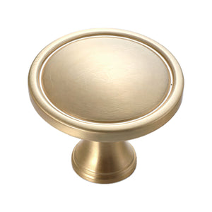 Brushed gold round cabinet knob with a raised rim.