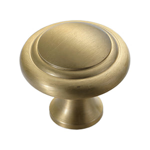 Brushed gold round cabinet knob with a recessed center, option No. 2.