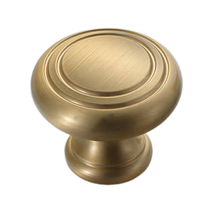 Brushed gold round cabinet knob with concentric rings, option No. 1.