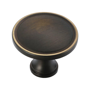 Coffee bronze round cabinet knob with a raised rim.