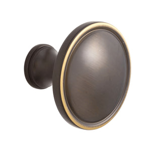 Coffee brown round cabinet knob with a dark face and brass-tone rim.