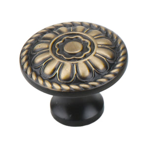 Dark antique-tone round cabinet knob with fluted gold-tone floral relief, option No. 6.