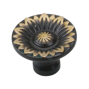 Dark antique-tone round cabinet knob with sunburst floral relief, option No. 7.