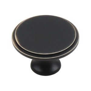 Dark bronze round cabinet knob with a flat top and fine gold-tone rim, option No. 5, 33 mm.