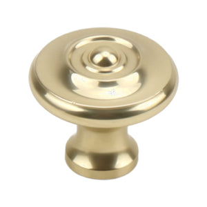Gold-tone round cabinet knob with a central button and concentric rings, option No. 2.