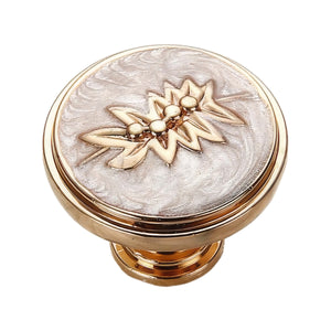 Gold-tone round cabinet knob with a pale pearly center and floral motif, option No. 2.