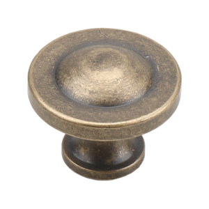 Old bronze round cabinet knob with a raised circular center, option No. 1.