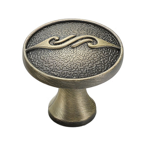 Bronze-colored oval cabinet knob with an etched face and curved crossbar, variant #7.