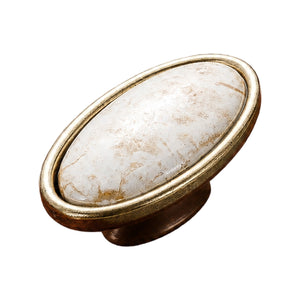 Antique bronze-tone oval cabinet knob with a white marble-look top and gold-tone rim, option No. 3.