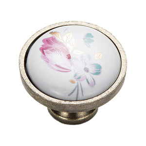 Round cabinet knob with a pink and pale blue floral design, variant #1.