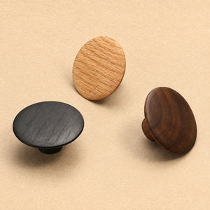 White oak, black oak and walnut flat round cabinet knobs, showing front and side views.