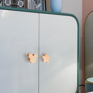 Mouse-shaped wood knobs on light cabinet doors.