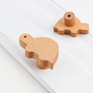 Multiple views of turtle-shaped wood cabinet knob or wall hook, style #11.