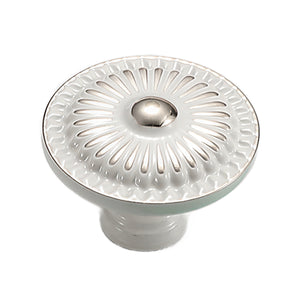 White and silver-tone round cabinet knob with a raised sunburst rosette, option No. 3.