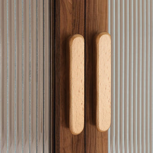 In-use view of slim rounded beech wood finger pull, 128 mm option.