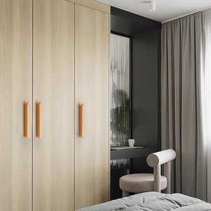 In-use view of slim rounded beech wood finger pull, 192 mm option.