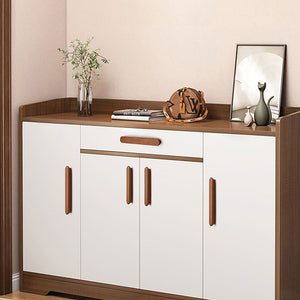 In-use view of slim rounded reddish wood finger pull, 64 mm option.