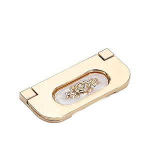 Gold-tone folding pull with an oval floral inset, style No. 1, 64 mm.