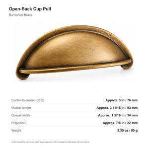 Dimensions of the open-back cup pull in Burnished Brass: 76 mm center-to-center, 93 mm long, 34 mm wide and 22 mm projection.