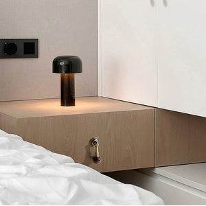 In-use view of bronze-finish drop pull with dark wood ball end, style #4 Bronze.