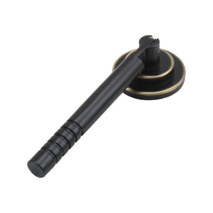 Dark bronze pendant drop pull with a round mounting plate, option No. 10.