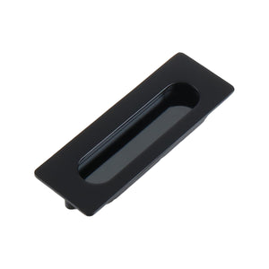 Black rectangular recessed cabinet pull with an oval finger grip, 106 mm.