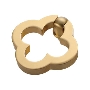 Brushed gold-tone quatrefoil ring pull with a top pivot, option No. 5.