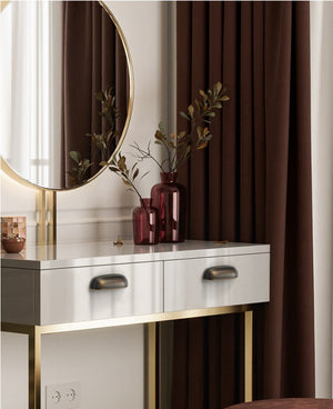 Solid brass rounded dome cup pulls in Antique Bronze on white dressing-table drawers beneath a round mirror.