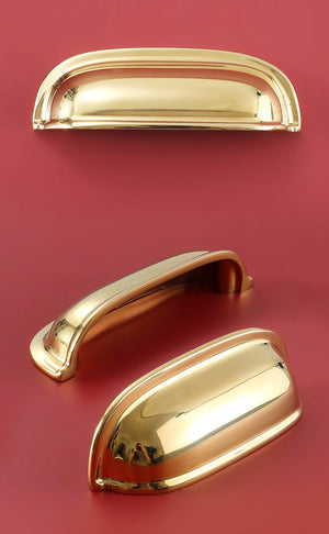 Front, underside and angled views of the solid brass rounded dome cup pull in Polished Gold.
