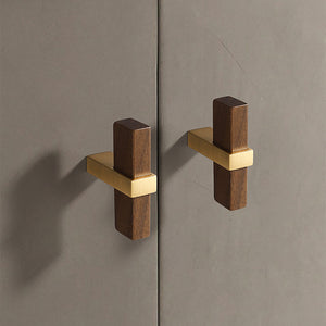 In-use view of walnut wood T-bar cabinet pull with a square brass center mount, style #2.