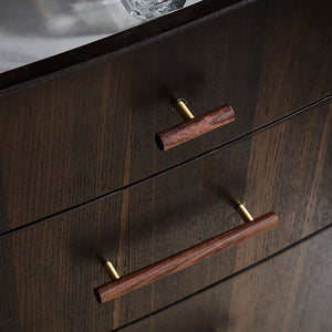 In-use view of walnut wood T-bar cabinet pull on a brass stem, style #5.