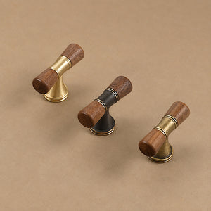 Three dark wood-ended T-bar pulls in brass, coffee and bronze finishes.