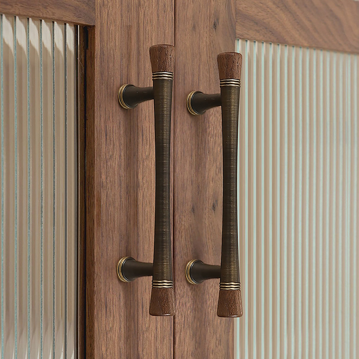 Coffee-finish cabinet bar pulls with dark wood ends installed on wood cabinet doors.