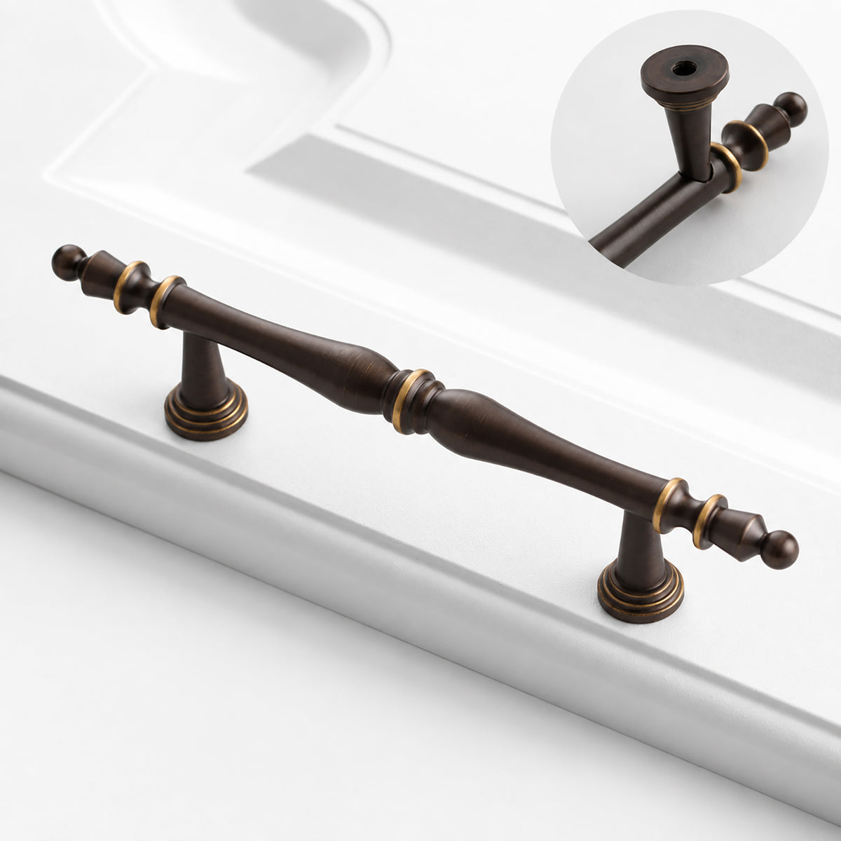 Turned dark antique brass cabinet bar pull with rear mounting detail.