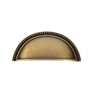 Beaded-Rim Half-Moon Cup Pull in Antique Brass, front view.