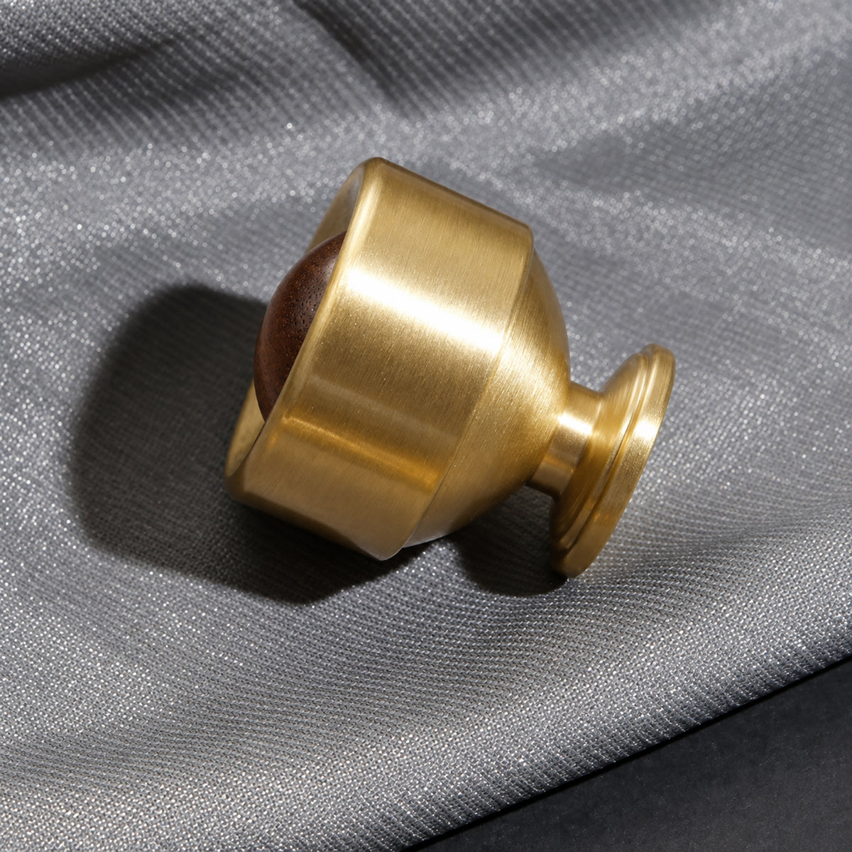 Side and mounting view of brass cup cabinet knob with a dark wood ball inset, style #1.