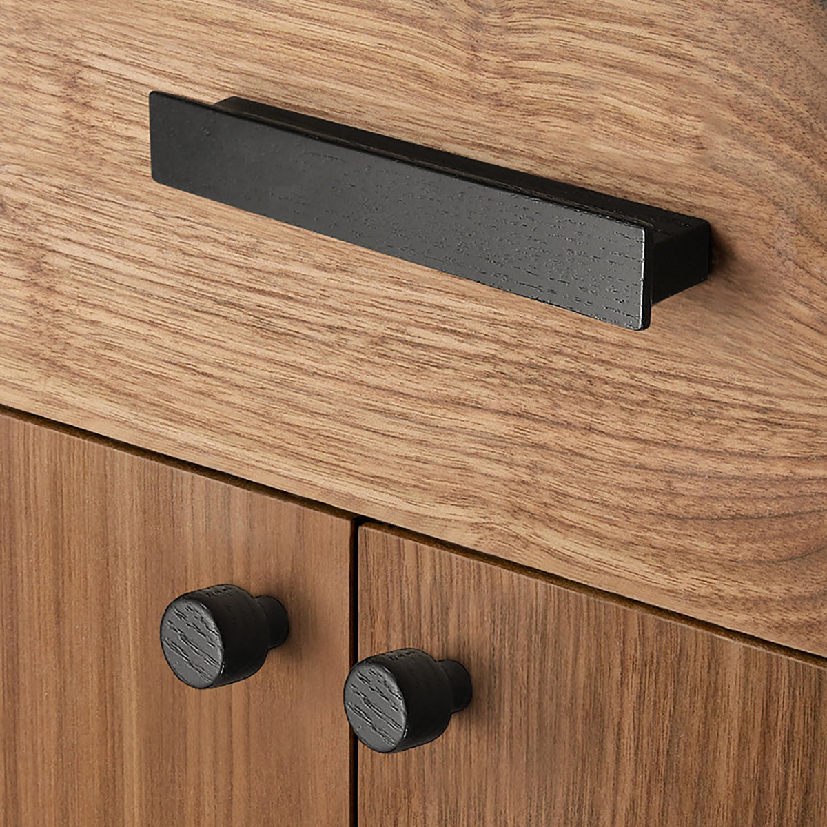 Round black-finish oak wood cabinet knob, style #1 fitted to cabinetry.