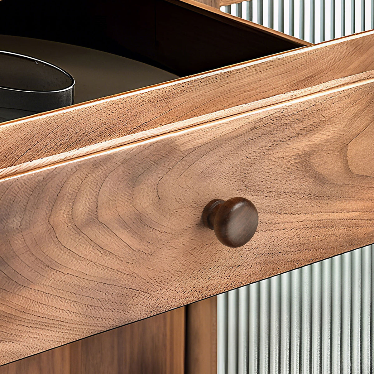 In-use view of dark wood mushroom cabinet knob with a rounded top, style #1.