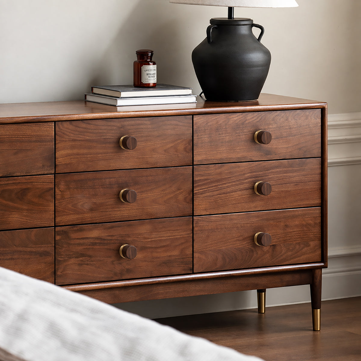 Walnut wood barrel cabinet knob with brass base, style #1 shown in a styled setting.
