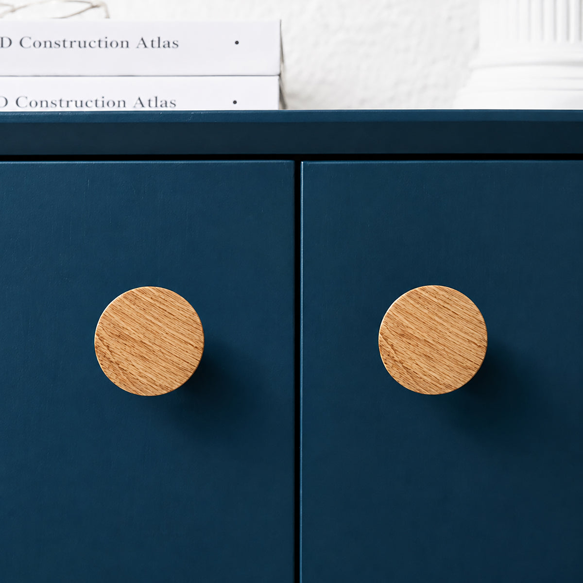 Wide round oak cabinet knob, style #10 shown in a styled setting.