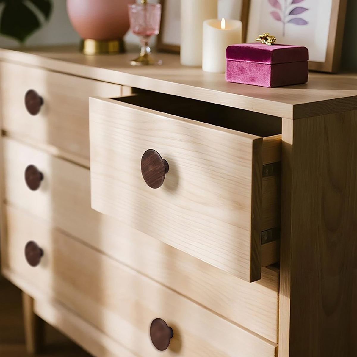 Wide round walnut cabinet knob, style #10 shown in a styled setting.