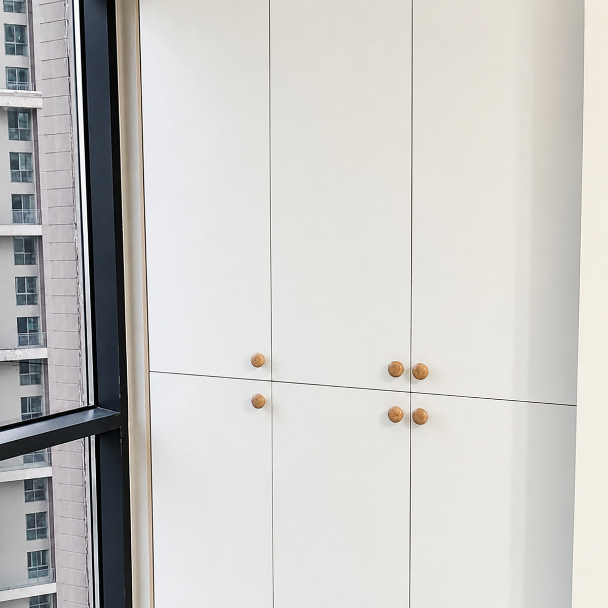 In-use view of light wood mushroom cabinet knob with a rounded top, style #2 (48 mm).