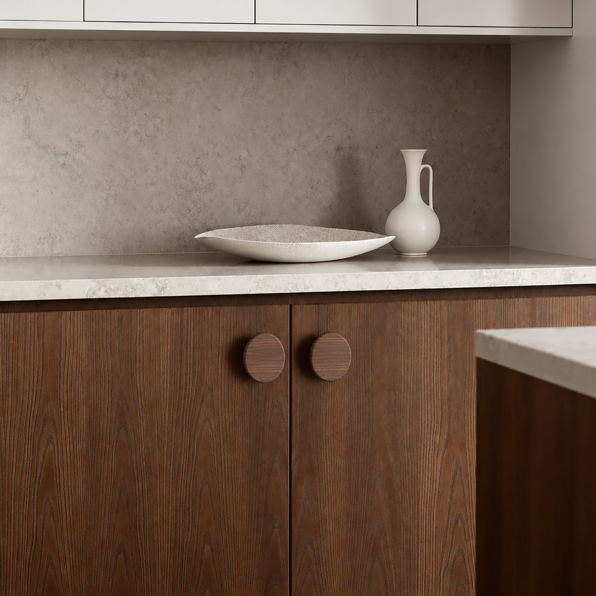 In-use view of flat round walnut wood cabinet knob, style #3 (48 mm).