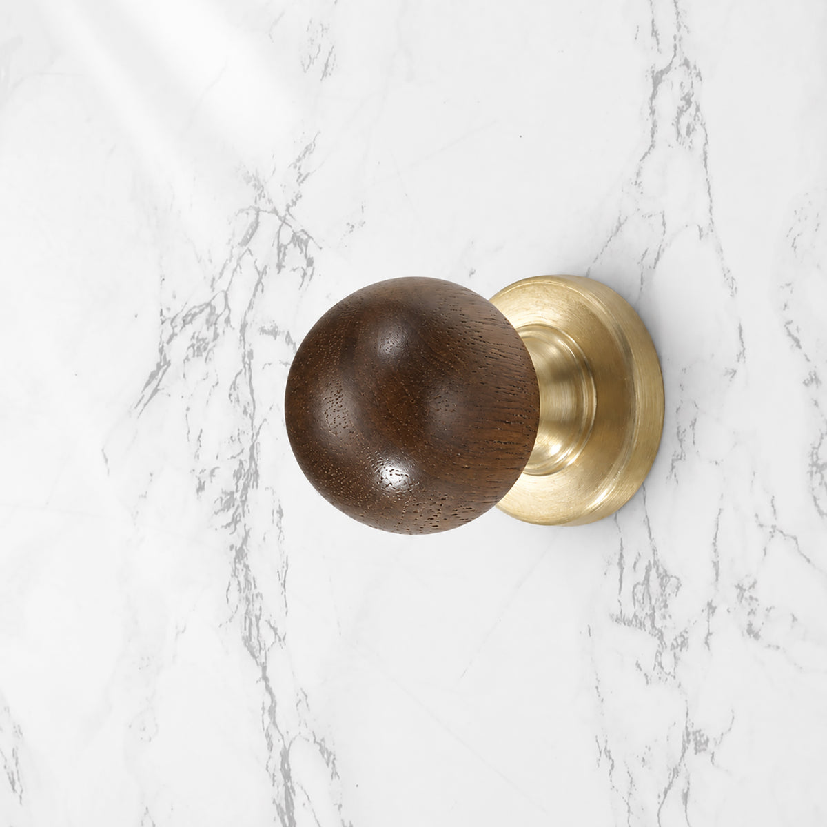 Side and mounting view of dark wood ball cabinet knob on a brass base, style #3 (25 mm).