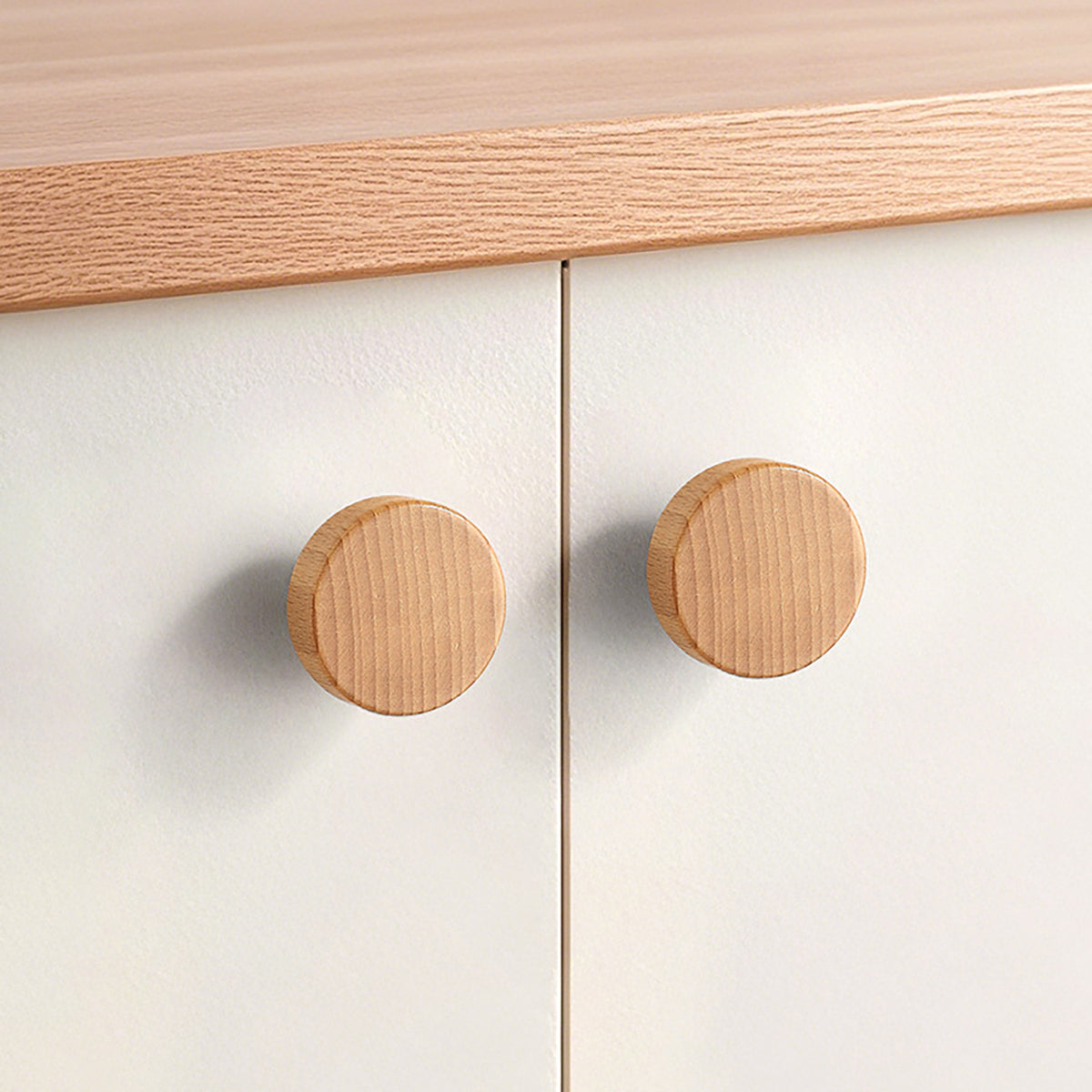 In-use view of light oak wood cylindrical cabinet knob with flat top, style #5 (35 mm).