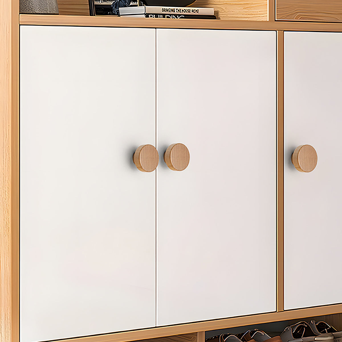 In-use view of light oak wood cylindrical cabinet knob with flat top, style #5 (45 mm).