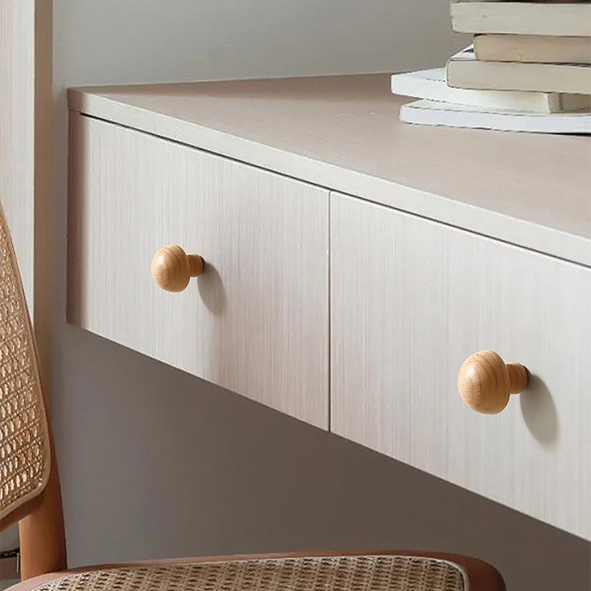 In-use view of light oak wood domed cabinet knob, style #6.
