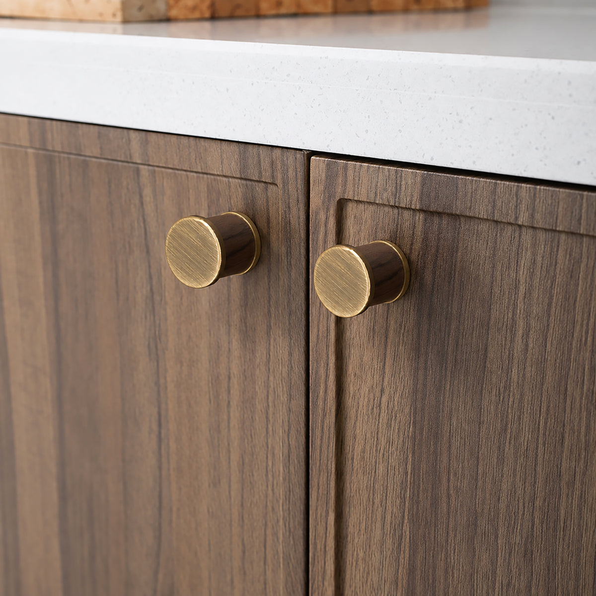 In-use view of dark wood barrel cabinet knob with bronze-finish end caps, style #7 Bronze.